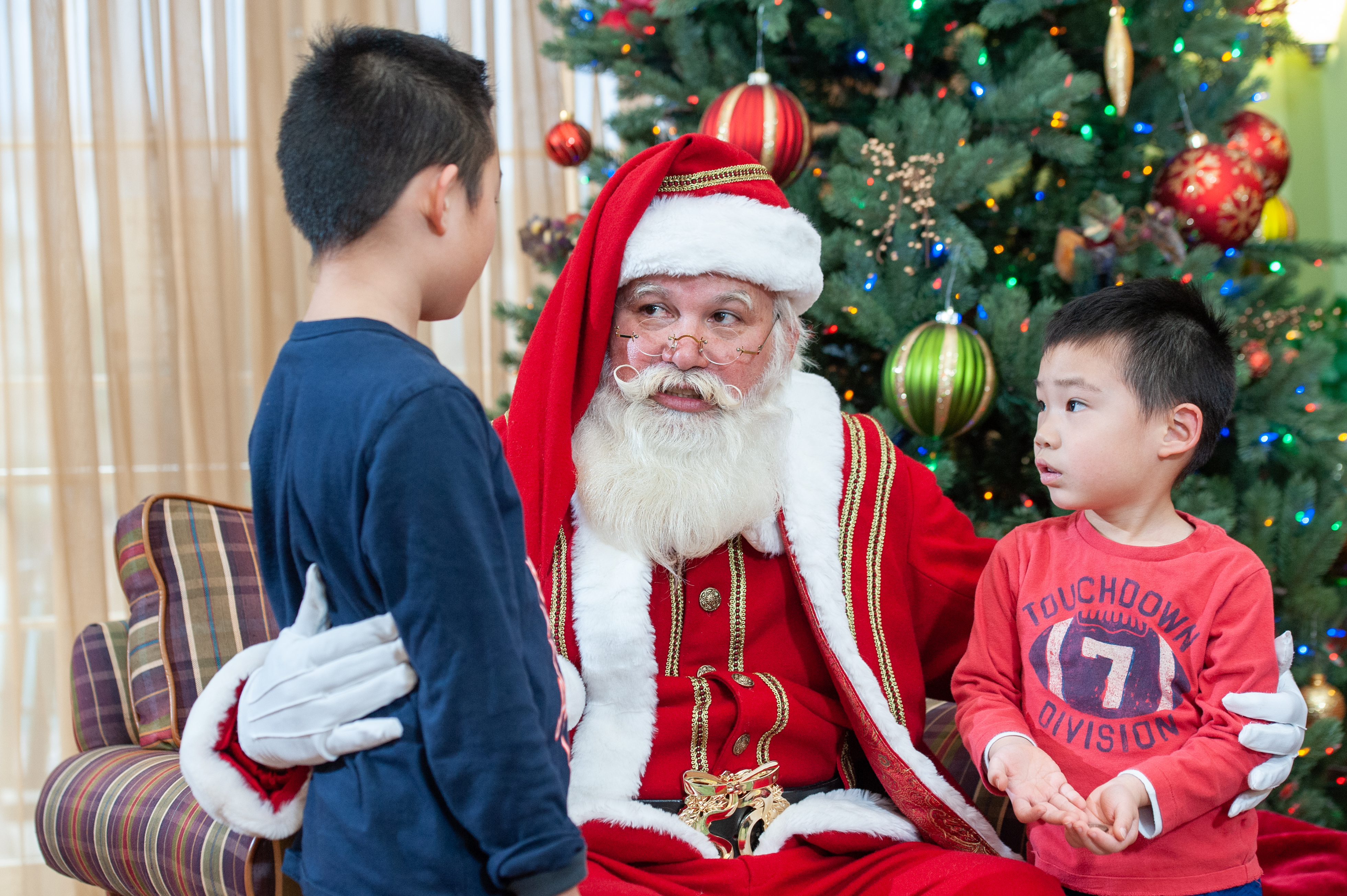 Santa listens to one of his many fans. thumbnail