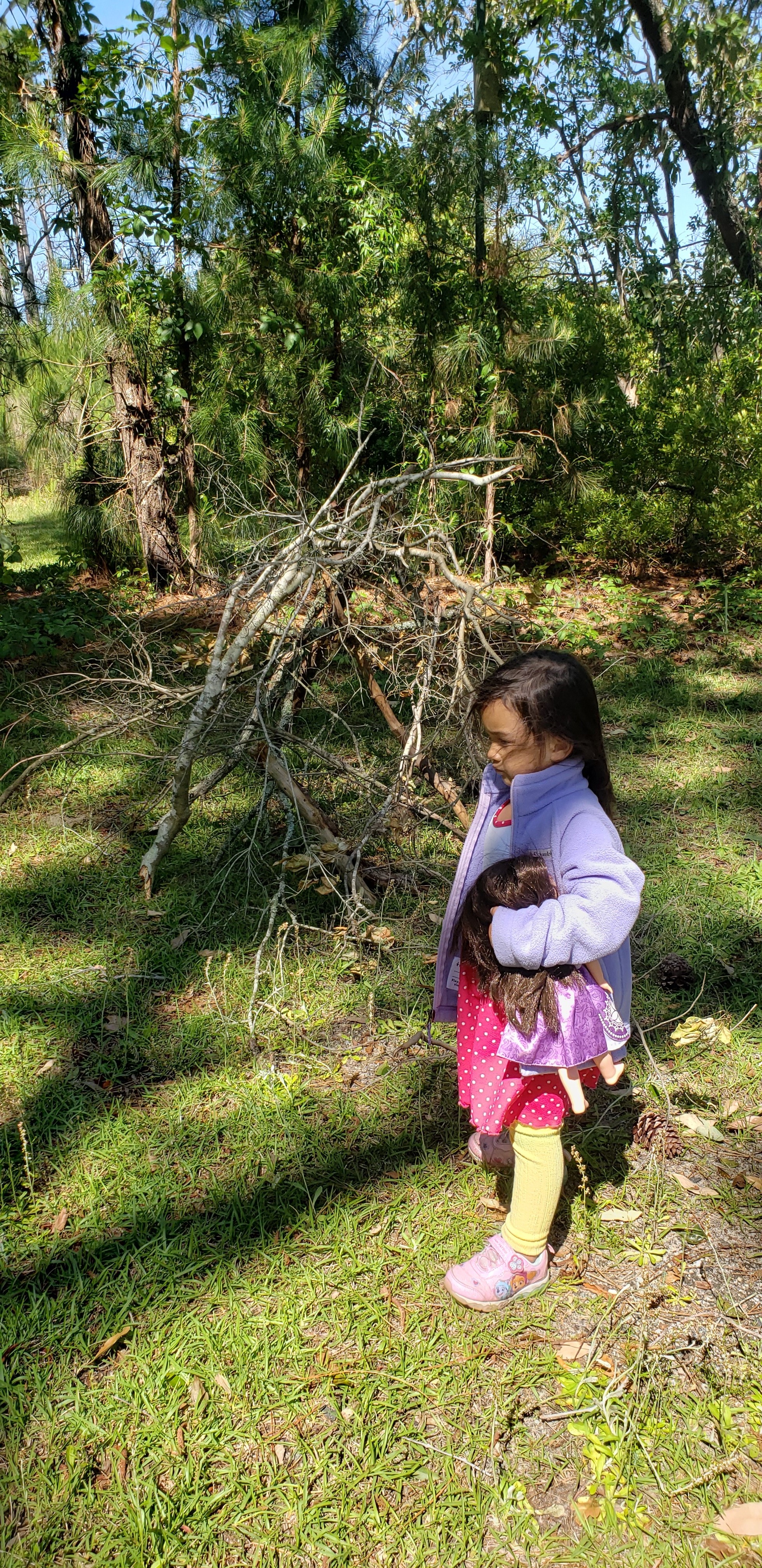 Quinn Avery out enjoying nature with her make believe barbie camper that she created from twigs found. thumbnail