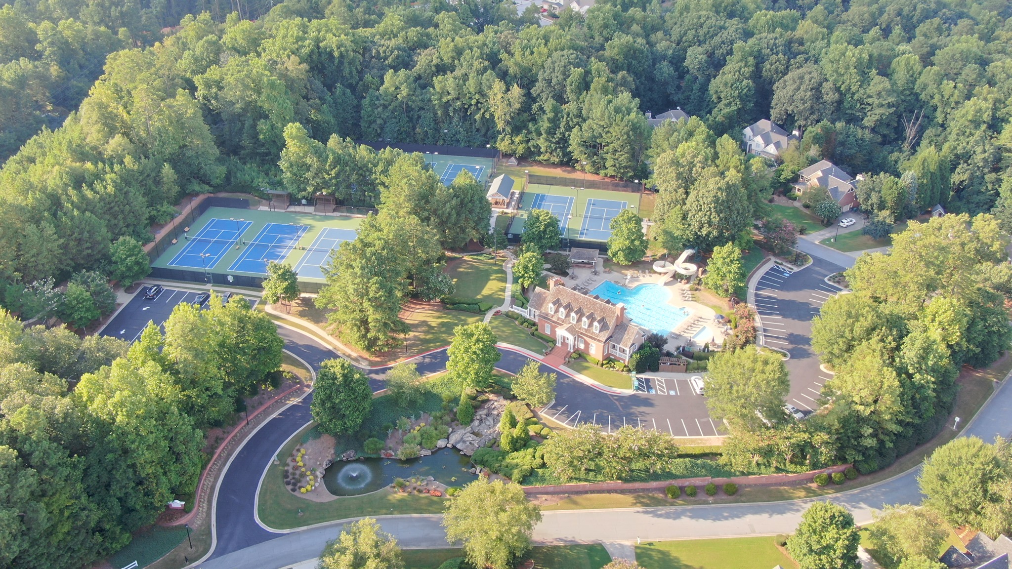 Aerial view of the Crescent Ridge Clubhouse, tennis courts, and pool. thumbnail
